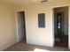 A bedroom with neutral walls, carpeted floors, and doorways leading to additional spaces at 3714 Palm Desert Ln # 5337, Orlando, FL 32839