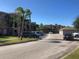 View of condos in a desirable neighborhood with meticulously manicured landscaping and well-maintained asphalt roads at 3714 Palm Desert Ln # 5337, Orlando, FL 32839