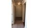 Well-lit hallway featuring carpet and a neutral color palette to give the home a clean and modern look at 3714 Palm Desert Ln # 5337, Orlando, FL 32839
