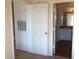The hallway features neutral walls and white doors that lead to rooms with hardwood floors and modern lighting at 3714 Palm Desert Ln # 5337, Orlando, FL 32839