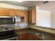Kitchen featuring stainless steel appliances, ample cabinet space, and a well-lit interior at 3714 Palm Desert Ln # 5337, Orlando, FL 32839