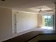Bright and airy living room featuring a ceiling fan and a sliding glass door to the balcony at 3714 Palm Desert Ln # 5337, Orlando, FL 32839