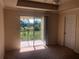 Bright and airy living room featuring a ceiling fan and a sliding glass door to the balcony at 3714 Palm Desert Ln # 5337, Orlando, FL 32839