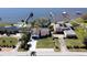 Aerial view of waterfront property with a grassy yard, personal docks and beautiful surroundings at 382 Riverside Dr, Ormond Beach, FL 32176