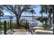Inviting back porch with stylish seating and a view of the waterfront and private dock at 382 Riverside Dr, Ormond Beach, FL 32176