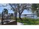 Comfortable back porch with a waterfront view, a private dock and green grass at 382 Riverside Dr, Ormond Beach, FL 32176