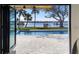 Expansive backyard boasting a sparkling pool, lush greenery, a private dock, and a tranquil water view at 382 Riverside Dr, Ormond Beach, FL 32176