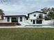 Spacious backyard featuring a pool, deck, and modern architectural design at 382 Riverside Dr, Ormond Beach, FL 32176