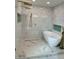 Elegant bathroom featuring a freestanding tub and marble tiled shower with gold fixtures at 382 Riverside Dr, Ormond Beach, FL 32176