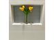 Close-up of a shower niche with decorative flowers against a soft blue tiled backsplash at 382 Riverside Dr, Ormond Beach, FL 32176
