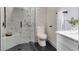 Modern bathroom featuring a glass-enclosed shower, marble-style tile, and sleek fixtures at 382 Riverside Dr, Ormond Beach, FL 32176