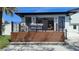 Relaxing outdoor deck with comfortable seating, offering a great view of the manicured lawn at 382 Riverside Dr, Ormond Beach, FL 32176