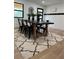 Bright dining area features a black table, black chairs, and a patterned rug, with modern decor at 382 Riverside Dr, Ormond Beach, FL 32176