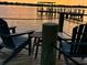 Sunset view on the home's private dock with comfortable seating area and a picturesque waterfront panorama at 382 Riverside Dr, Ormond Beach, FL 32176