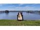 Private wooden dock on the water with multiple boat slips and a gazebo in the background at 382 Riverside Dr, Ormond Beach, FL 32176