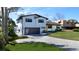 Beautiful two-story home features a modern exterior, large driveway, and well-manicured lawn at 382 Riverside Dr, Ormond Beach, FL 32176