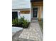 Front entrance with a stone walkway, modern door, and the house number visible at 382 Riverside Dr, Ormond Beach, FL 32176
