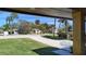 View of the front yard, driveway, and street from the porch at 382 Riverside Dr, Ormond Beach, FL 32176