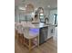 Spacious kitchen with a large island, stylish chairs, and modern appliances at 382 Riverside Dr, Ormond Beach, FL 32176