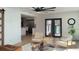 A bright living room with neutral furniture, wood floors, and a view into the adjacent kitchen area at 382 Riverside Dr, Ormond Beach, FL 32176