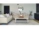 Bright and airy living room with neutral decor and plenty of seating at 382 Riverside Dr, Ormond Beach, FL 32176
