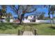 Stunning waterfront home featuring a private dock, pool, deck, and lush landscaping at 382 Riverside Dr, Ormond Beach, FL 32176
