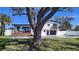 Beautiful waterfront home featuring a private pool, deck, patio, and lush landscaping at 382 Riverside Dr, Ormond Beach, FL 32176