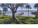 Waterfront home with private dock, mature shade trees, lush lawn, and breathtaking views at 382 Riverside Dr, Ormond Beach, FL 32176