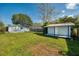 Spacious backyard with a shed and patio, perfect for outdoor activities and relaxation at 430 E Crystal Lake St, Orlando, FL 32806