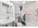 Bright bathroom featuring a tub and shower combo with updated fixtures at 430 E Crystal Lake St, Orlando, FL 32806