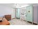 Bedroom with colorful armoires, a vanity, and a wooden dresser at 430 E Crystal Lake St, Orlando, FL 32806