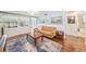 Cozy living room with hardwood floors, an area rug, and lots of natural light at 430 E Crystal Lake St, Orlando, FL 32806