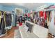 Bright room featuring a sofa, storage, and clothing racks at 430 E Crystal Lake St, Orlando, FL 32806