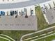 Aerial view of a residential area highlighting community parking, landscaping, and pedestrian pathways at 4715 Coral Castle Dr, Kissimmee, FL 34746
