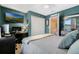 Comfortable bedroom featuring a cozy bed, desk, and modern amenities, perfect for rest and productivity at 4715 Coral Castle Dr, Kissimmee, FL 34746