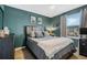 Stylish bedroom featuring a comfortable bed, modern decor, and ample natural light from the large window at 4715 Coral Castle Dr, Kissimmee, FL 34746