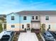 Charming multi-colored townhome featuring well-maintained landscaping and a private driveway in a desirable neighborhood at 4715 Coral Castle Dr, Kissimmee, FL 34746