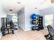 Spacious fitness center with exercise equipment and weights for residents at 4715 Coral Castle Dr, Kissimmee, FL 34746