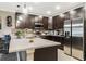 Modern kitchen featuring stainless steel appliances, granite countertops, a tile backsplash, and ample storage space at 4715 Coral Castle Dr, Kissimmee, FL 34746