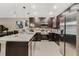 Modern kitchen featuring stainless steel appliances, sleek countertops, and ample cabinet space for storage at 4715 Coral Castle Dr, Kissimmee, FL 34746