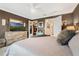 Comfortable main bedroom featuring a dresser with TV, closet, and cozy decor at 4715 Coral Castle Dr, Kissimmee, FL 34746