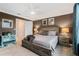 Relaxing main bedroom featuring neutral tones, a comfortable bed, and stylish decor for a serene atmosphere at 4715 Coral Castle Dr, Kissimmee, FL 34746