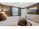 Inviting main bedroom with soft colors, a comfortable bed, and plenty of natural light at 4715 Coral Castle Dr, Kissimmee, FL 34746