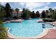 Large community pool with sparkling clear water and several lounge chairs for relaxing poolside at 4715 Coral Castle Dr, Kissimmee, FL 34746