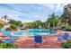 Community pool with ample seating, providing a perfect spot for relaxation and socializing at 4715 Coral Castle Dr, Kissimmee, FL 34746