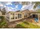 Exterior shot of backyard including the sun room at 545 Ne 45Th Ct, Ocala, FL 34470