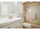 This bathroom features a white sink vanity and a tub with shower at 545 Ne 45Th Ct, Ocala, FL 34470