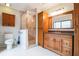 Bathroom featuring a glass-enclosed shower, tile floors, and wooden vanity at 545 Ne 45Th Ct, Ocala, FL 34470