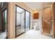 Bathroom with glass shower, toilet and access to a private outdoor space at 545 Ne 45Th Ct, Ocala, FL 34470