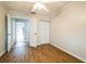 Bedroom with laminate flooring, crown molding, and open closet doors at 545 Ne 45Th Ct, Ocala, FL 34470